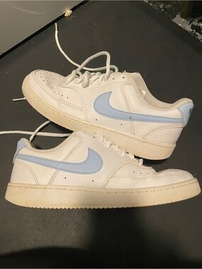 Nike White Low-Top Sneakers with Light Blue Swoosh